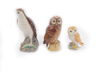 A Beswick Beneagles osprey decanter, Whyte & Mackay tawny owl decanter, and a Beswick owl, No 2026. (3)