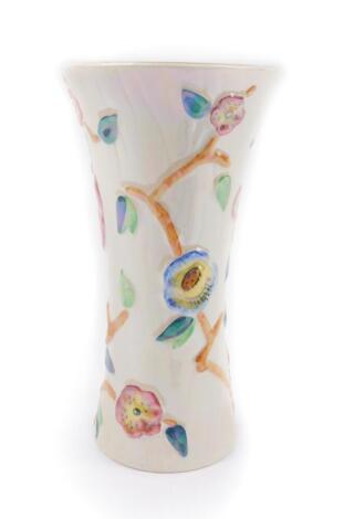 An early 20thC Arthur Wood lustre pottery vase, of waisted form, moulded with climbing flowers, No 4704, printed marks, 26cm H.