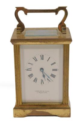 A brass cased carriage clock for Garrard & Company Limited, 112 Regent St, London W1, rectangular dial bearing Roman numerals, the case with fluted sides, 12.5cm H, 8cm W, 6cm D.