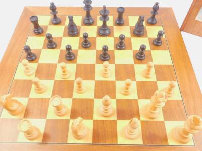 A Gibsons boxwood Staunton pattern chess set, boxed, together with a wooden chess board, 50cm x 50cm. (2) - 2