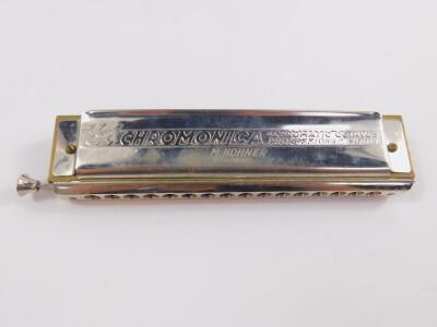 A Hohner Chromonica, The Sixty Four, four chromatic octaves professional model, cased. - 2