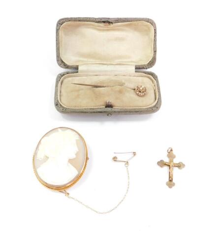 A 9ct gold and shell cameo brooch, bust portrait of a lady, with safety chain as fitted, together with a 9ct gold crucifix pendant, and a Victorian seed pearl set crescent moon and star tie pin, in yellow metal, 11.9g.