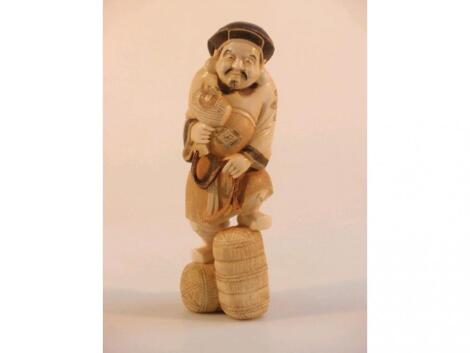 A Japanese Meiji period ivory figure of Hotei