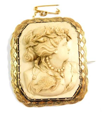 A late 19thC Continental lava cameo brooch, decorated in high relief with a bust portrait of a lady, within a yellow metal frame, with safety chain as fitted.