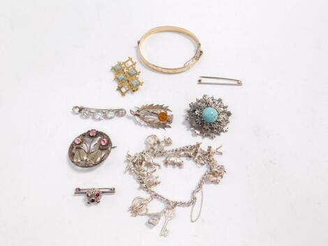 Silver and costume jewellery, including a 9ct gold plated bangle on a snap clasp, silver charm bracelet, brooches, etc. (qty)