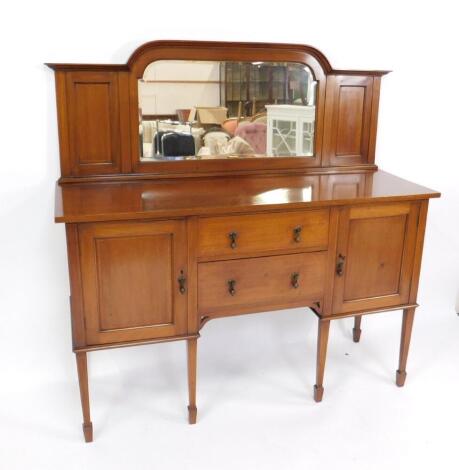 An Edwardian mahogany and satinwood crossbanded mirror back sideboard, with two central drawers flanked by cupboard doors enclosing shelves, raised on tapering square legs and spade feet, 155cm H, 153cm W, 53cm D.