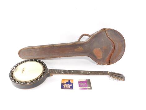 An early 20thC banjo mandolin, leather cased, 94.5cm L.