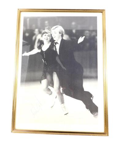 An autographed black and white photograph of Jane Torvill and Christopher Dean, framed and glazed, 39cm x 28cm.