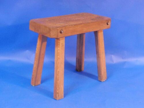 A butchers block table raised on four legs