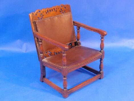 A Jacobean style oak folding monks chair/table