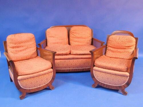 A 1930's walnut framed bergere three-piece suite