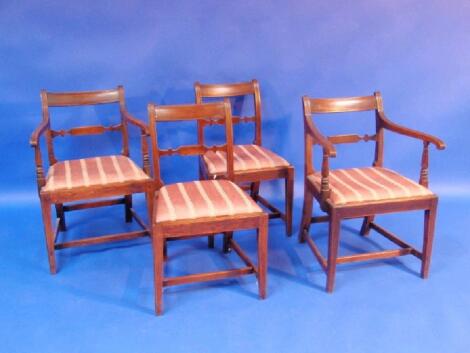 A set of four George III elm dining chairs including two carvers