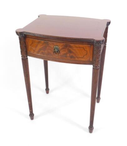 A Georgian style mahogany and inlaid bow fronted side table, with single frieze drawer, raised on fluted and carved acanthus leaves legs, 52cm W, 41cm D, 72cm H.