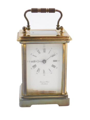 A French brass carriage clock, dial bearing Roman and Arabic numerals, single barrel movement, For Bornand Freres, Mont Beliard, with key, 11.5cm H, 8cm W, 7cm D.