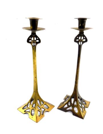 A pair of late 19thC Art Nouveau brass candlesticks, of openwork square design, 36.5cm H.