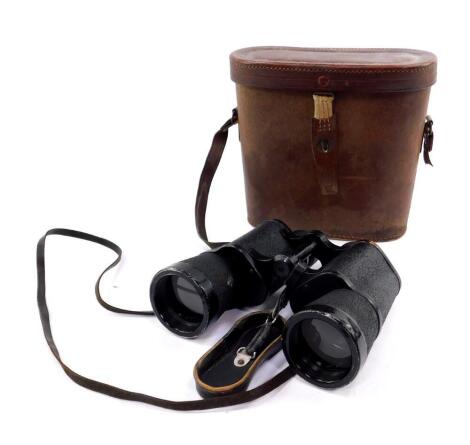 A pair of WWII German Third Reich binoculars, probably Kriegsmarine, right side stamped Artl, DF7x50, 1590 Ost, left side mark erased, serial number 67990, the leather eye cover stamped with a swastika, eagle, M&RE, cased.