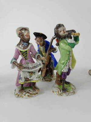 A collection of Volkstedt porcelain monkey band figures, in the Meissen style with various figures, to include the conductor, violinist, pianist etc., various sizes, printed mark in blue to underside and some numbered. (20) - 3