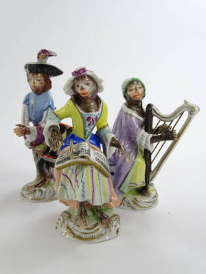 A collection of Volkstedt porcelain monkey band figures, in the Meissen style with various figures, to include the conductor, violinist, pianist etc., various sizes, printed mark in blue to underside and some numbered. (20) - 6