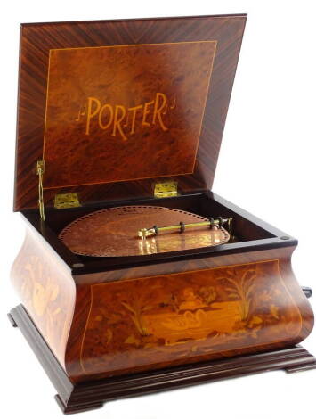 A late 20th/early 21stC Porter American polyphon, the case decorated with simulated marquetry musical instruments etc., sold with a number of 12" copper plated discs with original paperwork etc.