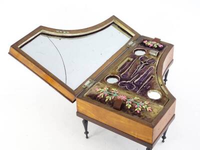 An early 19thC satinwood piano shaped musical box, the hinged lid with inlaid keys and inset with a mirror (AF), the interior with embroidered padding, velvet lining, containing some fittings, on turned legs, 30cm L. - 2