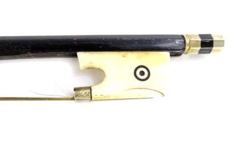 A continental ebonised violin bow, with carved ivory frog (AF), 70cm L.