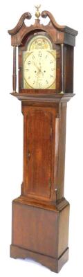 Thomas Marshall of Lincoln. A mid 19thC oak and mahogany cross banded long case clock, the arched dial painted with thistles, flowers etc., with subsidiary seconds hand, the case with swan neck pediment, turned pillars and shell inlay to door, with a four