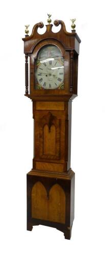 Joshua Barr, Wilford. A mid 19thC longcase clock, the arched dial painted with figure of Jesus kneeling and with decorative multi coloured spandrels surrounding the Roman numerals, eight day four pillar movement in a mahogany oak maple and ebony strung ca