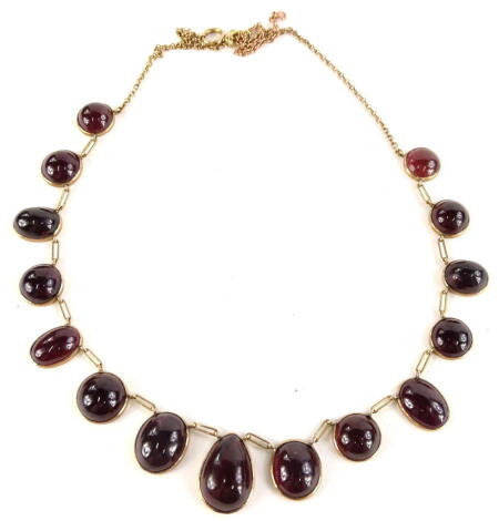 A 9ct gold Victorian style necklace, with mixed cut garnet stones, including oval, circular and tear drop, of fanned design, on fine link chain, with extender, 50cm long, 23.4g all in.