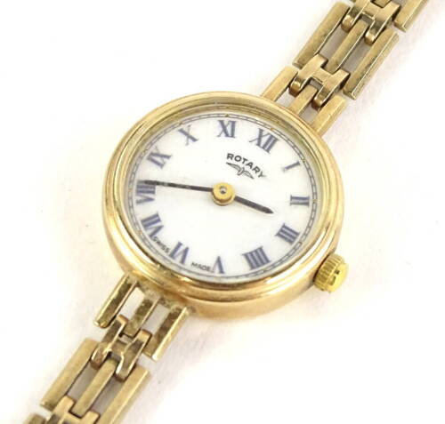 A 9ct gold Rotary ladies wristwatch, with small circular dial, with cream dial, on three row gold bracelet, 15g all in.