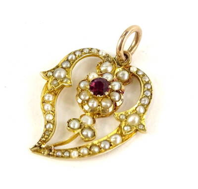 An Art Nouveau pendant, set with seed pearls and garnet stone, on yellow metal pendant back, marked 9ct, 2.5cm W, 2.6g all in.