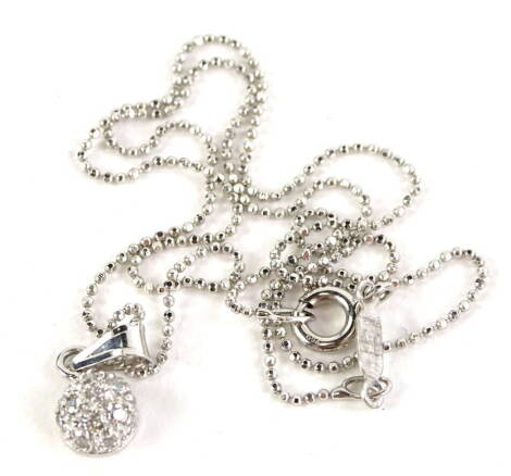 An 18ct white gold necklace, with circular pendant design, set with tiny diamonds, on ball design chain, 2.5g all in.