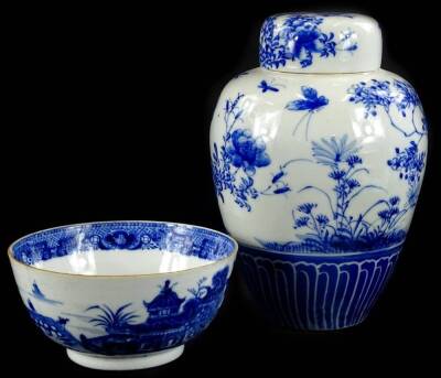 A late 18th/early 19thC Chinese porcelain blue and white bowl, decorated with river landscapes, buildings etc. (AF), 14cm dia. and a Japanese porcelain blue and white ginger jar and cover, 20cm H.