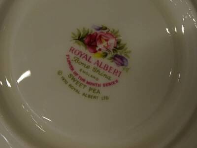 A collection of Royal Albert porcelain, to include various cups printed with months of the year, matching saucers etc. - 2
