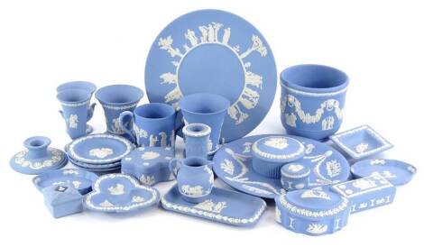 A quantity of Wedgwood pale blue jasperware, to include candlesticks, plates, boxes and covers, small urns etc.