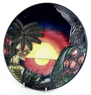 A Moorcroft calendar plate, decorated with a sunset scene with figure and conch shell, dated 2000, various marks to underside, 22cm dia.