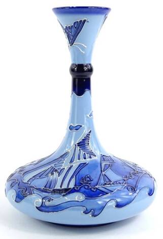 A Moorcroft bottle shaped vase, decorated with sailing ships in shades of blue, various marks to underside, to include J Moorcroft pattern number 1243 etc., 24cm H.