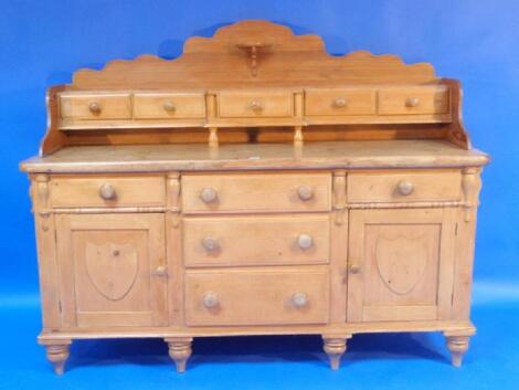 A Victorian stripped pine kitchen dresser