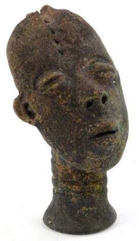 Tribal Art. A terracotta bust of a man with oval shaped head, tapering neck (AF), 18cm H.