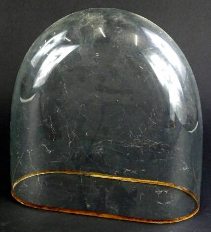 An arched glass dome, 28cm H, 28cm W.