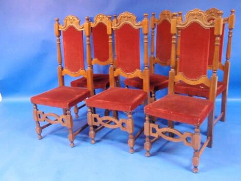 A set of six dining chairs with high backs