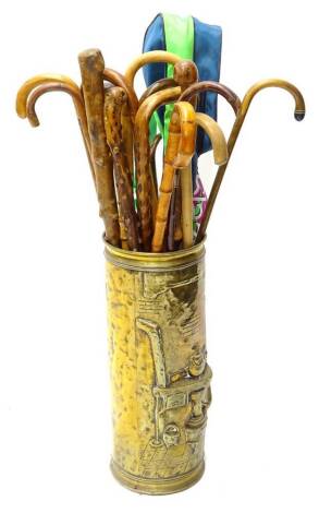 A quantity of walking sticks, to include a twisted briarwood walking stick, a walking stick carved with a serpent bearing initials T.C? etc.