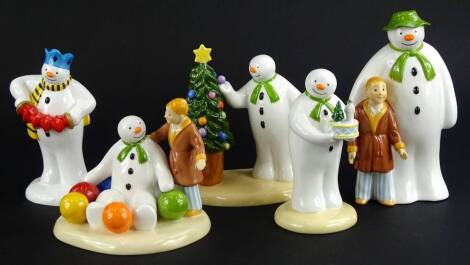 Five similar Coalport Snowman characters, Soft Landing, Play It again, Christmas Cheer, Snowman's Surprise and the 2002 money box snowman figures. (boxed)