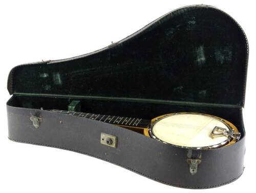 A Keech Banjolele banjo, numbered 219720/24, with ebonised finger board inlaid with mother of pearl, the main body bearing facsimile signature and veneered in maple, in a fitted case.