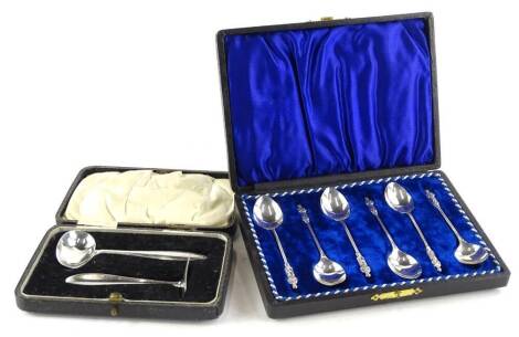 A George V silver baby feeder and pusher, in fitted case, Sheffield 1932, and a set of six George V silver teaspoons, Sheffield 1911, in a fitted case.