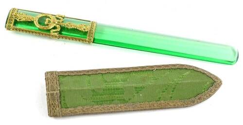 A French gilt metal and green glass page turner, decorated with breeze, bows, swags etc., 22.5cm L, in a fabric case.