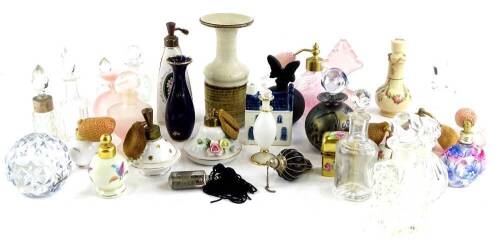 A quantity of scent bottles, to include a 19thC pottery example, decorated with flower swags, an iridescent Phoenician Maltese glass bottle and stopper, various other glass pieces, a Limoges scent bottle decorated with flowers on a gilt ground etc.