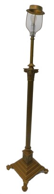 An early 20thC Corinthian column standard lamp, later painted in gold, on ball and claw feet, 163cm H.