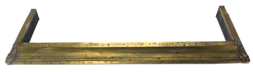 A late 19th/early 20thC brass fire kerb in Art Nouveau style, 130cm W.