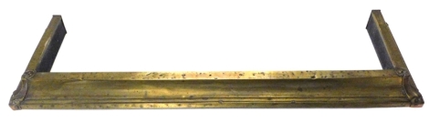 A late 19th/early 20thC brass fire kerb in Art Nouveau style, 130cm W.