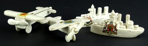 A First World War related crested items, to include two aeroplanes and two battleships.
